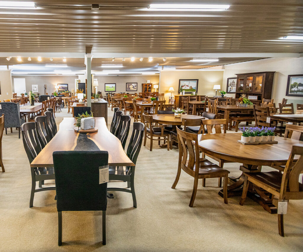 Showroom of handcrafted tables and chairs highlighting how Amish furniture is made.