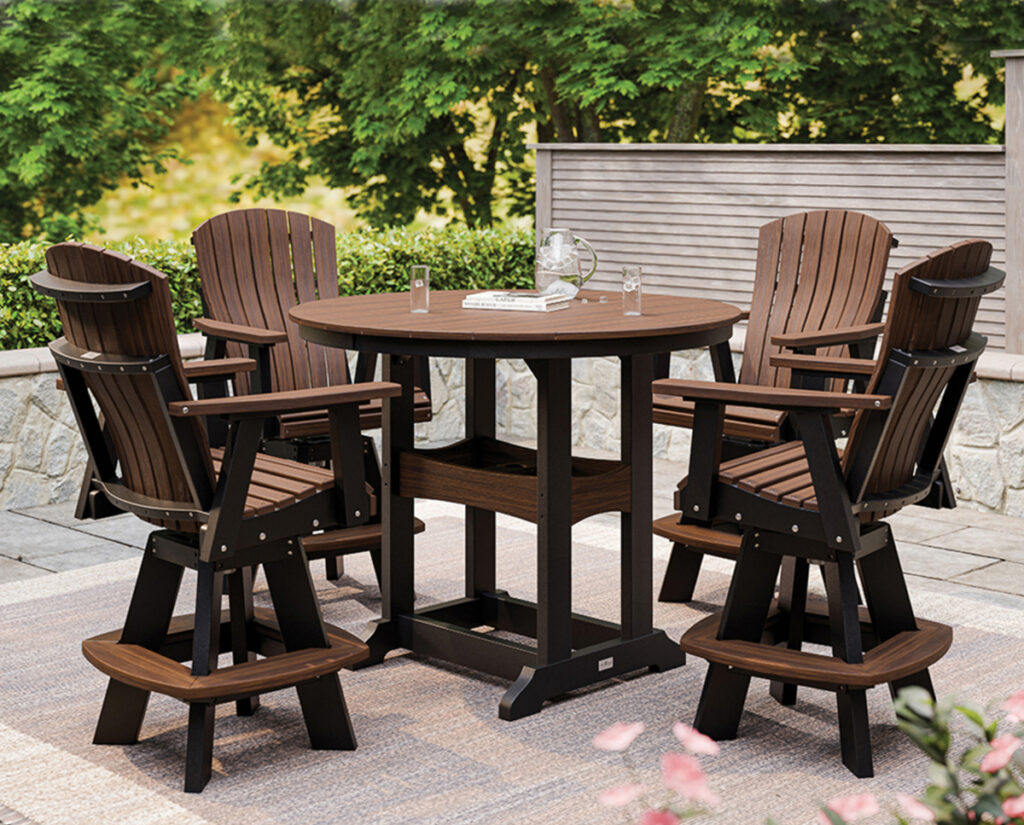 Round poly patio dining table with four swivel chairs on outdoor pavers.