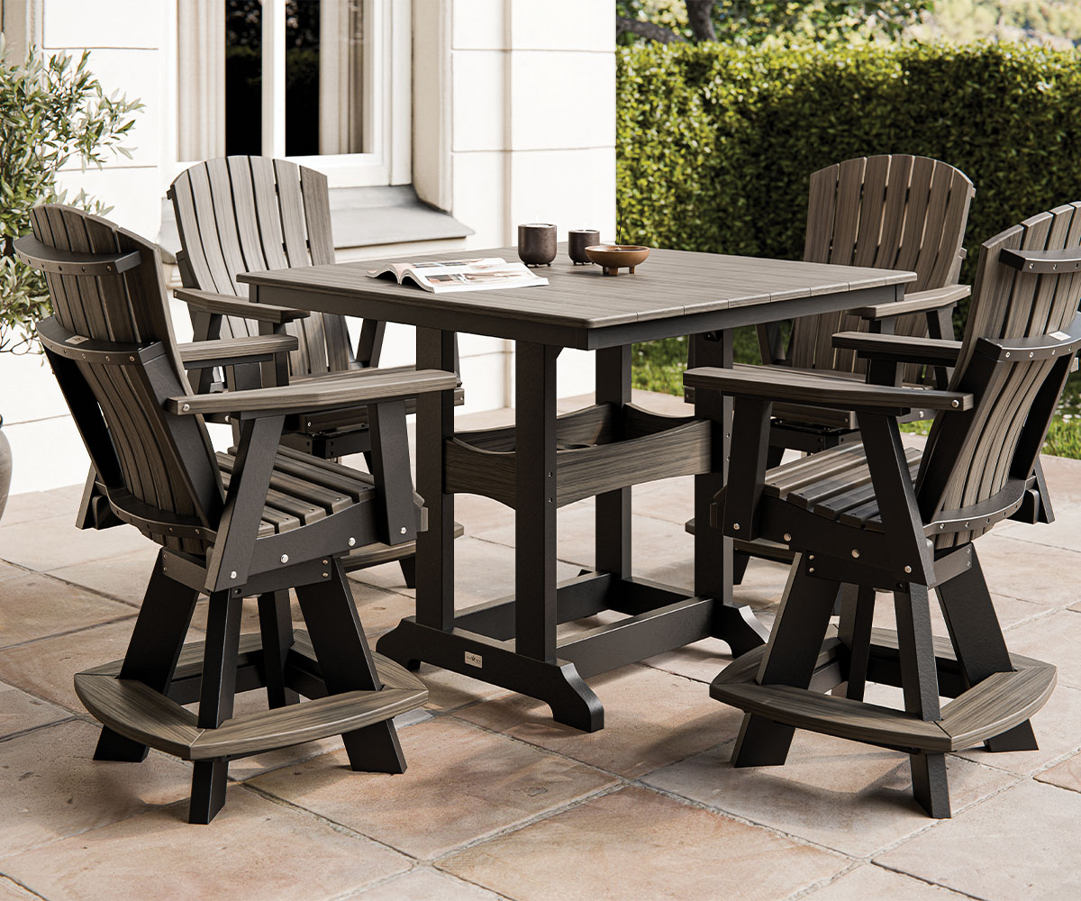 Eco-friendly outdoor dining set with poly lumber table and Adirondack chairs.