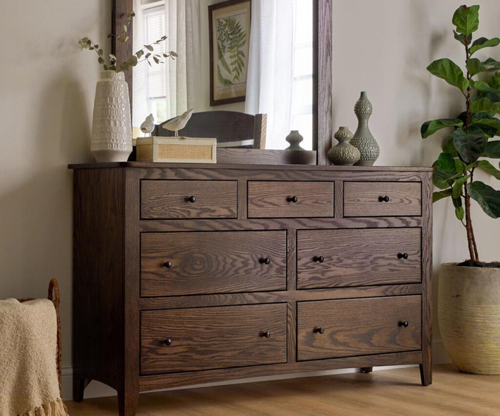 Quarter-sawn oak dresser showing bold grain and dark brown stain.